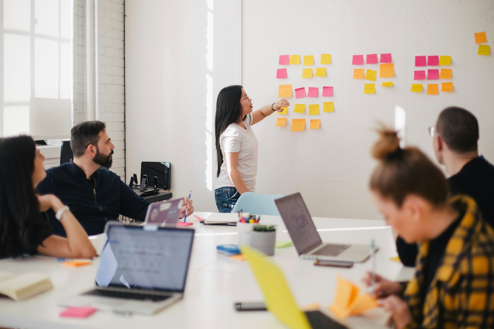Strategists mapping audience segments on a whiteboard during a workshop